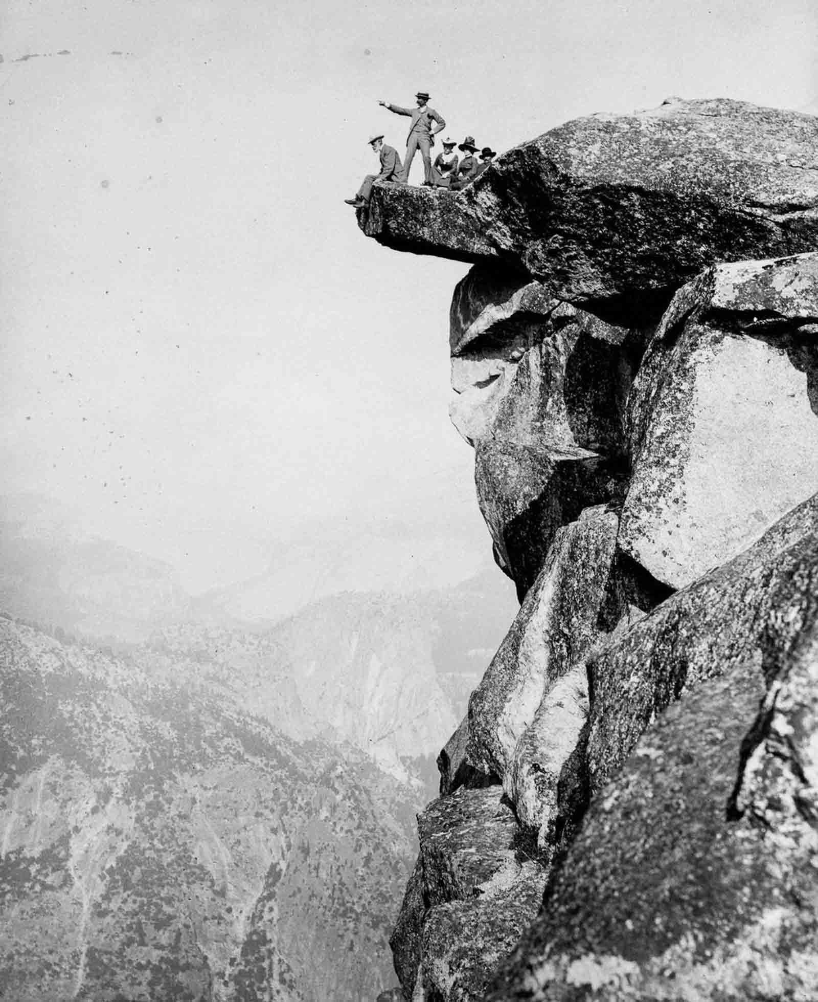 #4 Tourists pose on Glacier Point above the Yosemite Valley, 1887.
