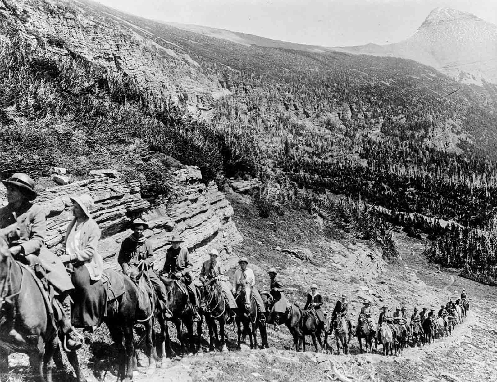 #18 Tourists ride up a trail in Rocky Mountain National Park, 1909.