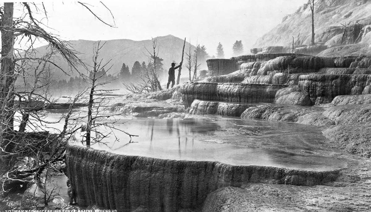 #10 A geological surveyor explores the lower basin of Mammoth Hot Springs in Yellowstone, 1870.