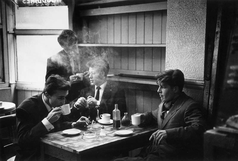 #14 A group of ‘spivs’ at a local cafe in the Notting Hill Gate area of London, 1954.