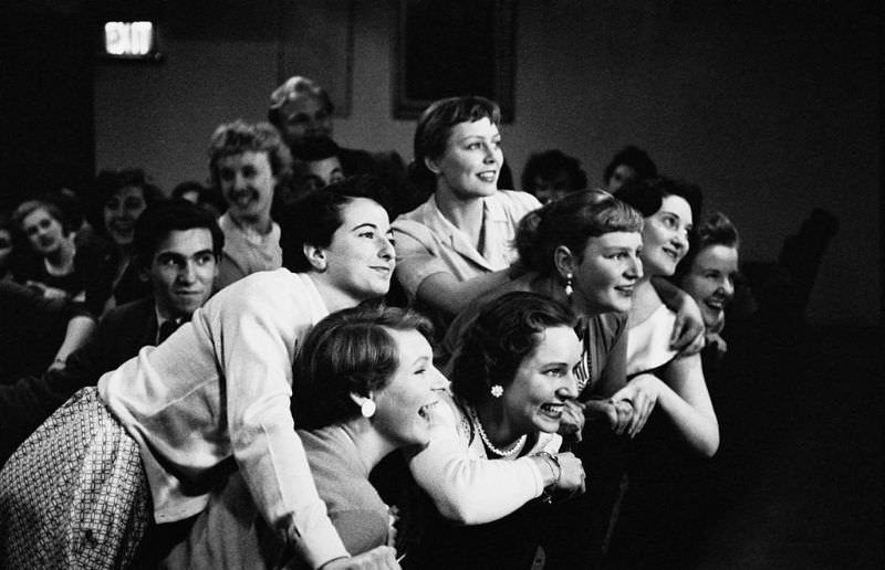 #16 A group of teenagers at a ceremony, 1955.