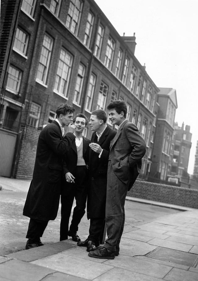 #20 A group of rock ‘n’ roll fans chatting on the street, 1956.