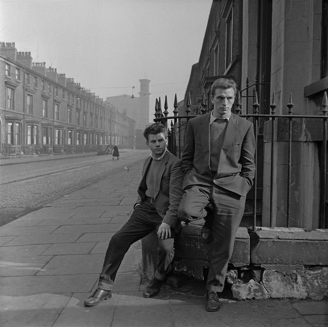 #22 A pair of unemployed teenagers on a street corner, Liverpool, 1957.