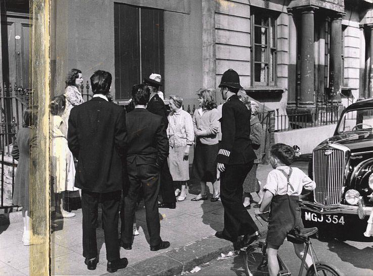 #33 Group with policeman, Southam Street, 1956