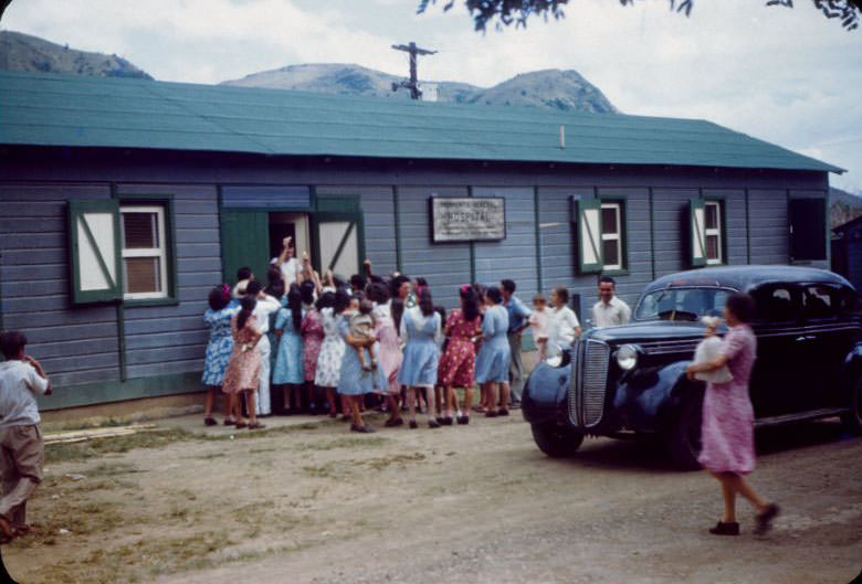 #34 Hospital door, crowd gathered around entrance to La Plata hospital, La Plata