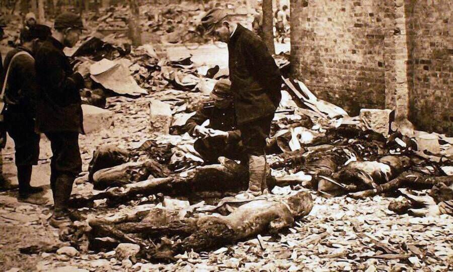 A Japanese policeman stands amidst the dead and rubble-strewn streets of Tokyo in the immediate aftermath of the capital’s firebombing. March 10, 1945. Tokyo, Japan.