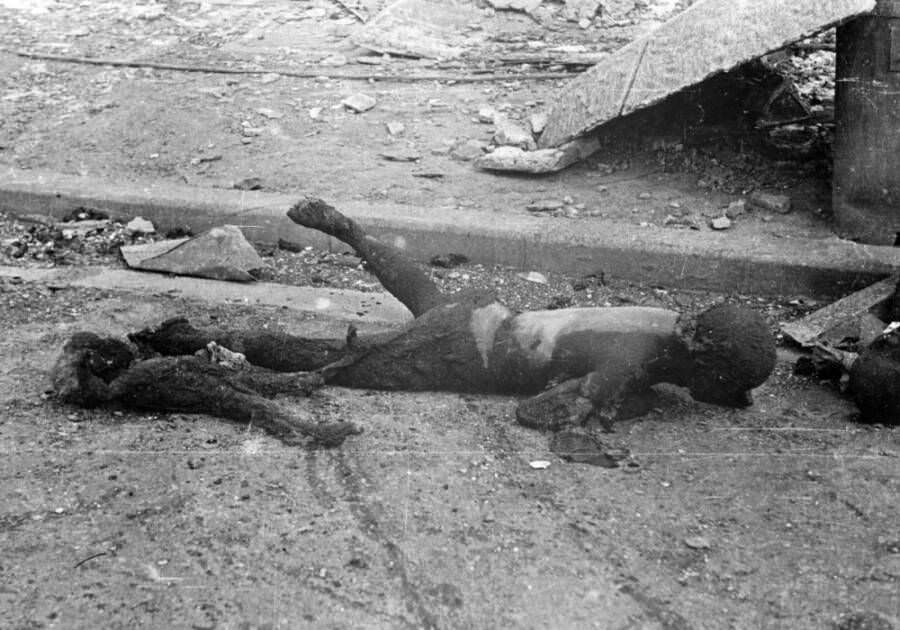 #9 The charred husk of a Tokyo woman who had been carrying her young child on her back. Both were among the 100,000 people killed during the city’s firebombing. March 10, 1945. Tokyo, Japan.
