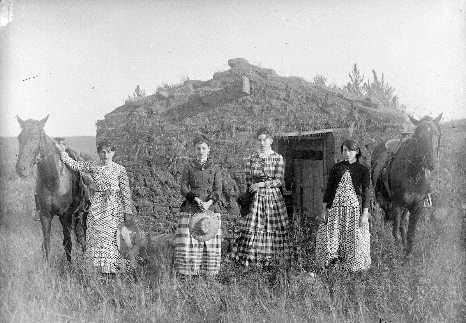 #2 Harriet, Elizabeth, Lucie, and Ruth Chrisman at their sod house in Custer County, Nebraska, 1886.
