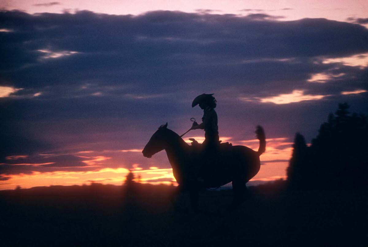 #19 A woman riding before an Oregon sunset in 1958.