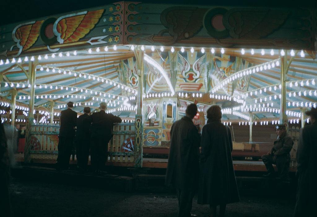 #5 People watching the dodgem cars at night, at Blackpool Pleasure Beach, Blackpool, 1955.