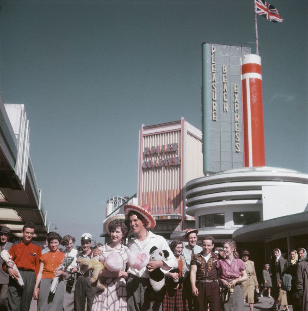 #30 Visitors and holidaymakers enjoy a trip to Blackpool Pleasure Beach amusement park in the seaside resort of Blackpool, Lancashire in July 1952.