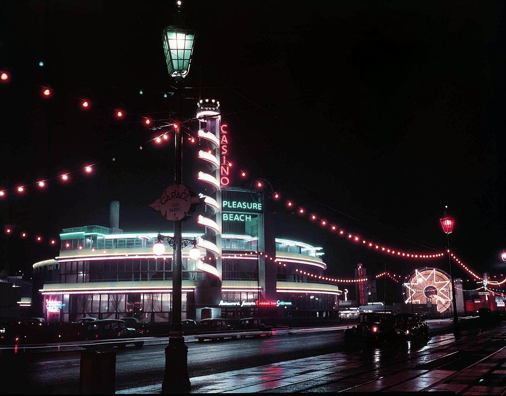 #39 View of the casino and pleasure beach buildings lit up during the Blackpool Illuminations annual lights festival in the seaside resort of Blackpool, 1950.