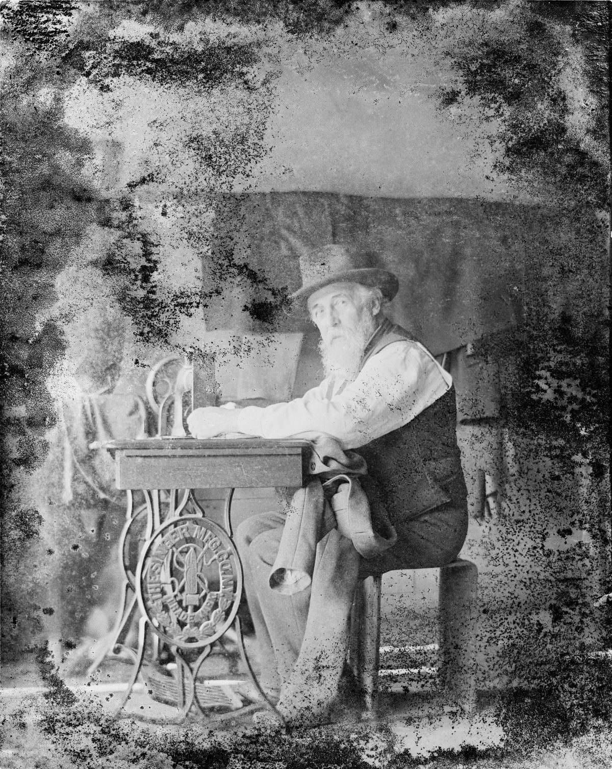 #4 Man working at sewing machine – George Silas Duntley Photographs 1899-1918