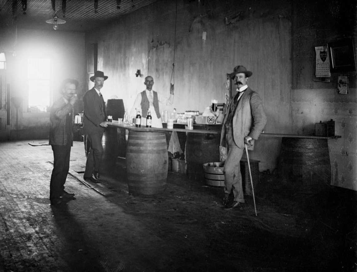 #31 Four men drinking in a bar