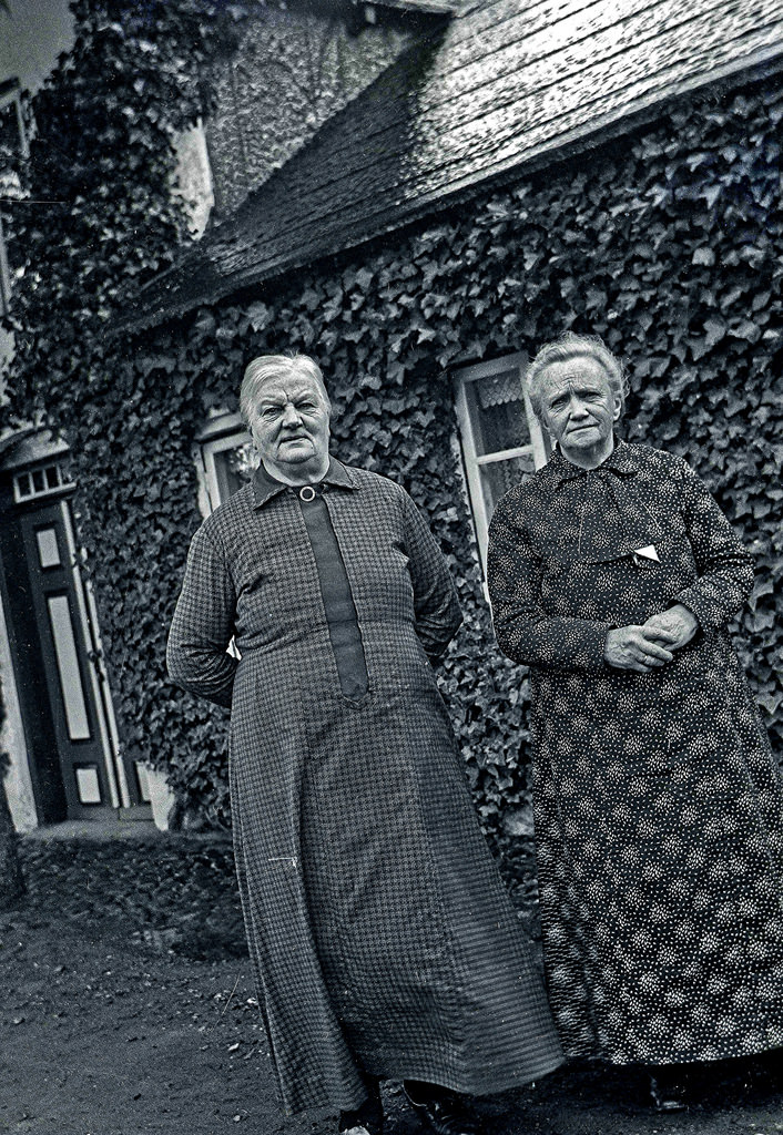 #31 Two old ladies stand in front of their house in Denmark, 1937