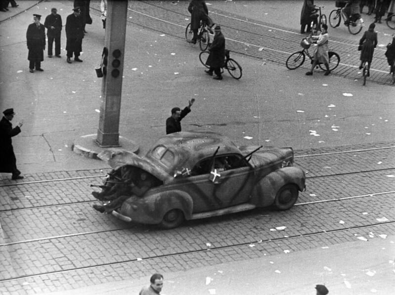 #42 Freedom fighters in a German car at The Central Square (Rådhuspladsen) in Copenhagen. 5th May 1945.