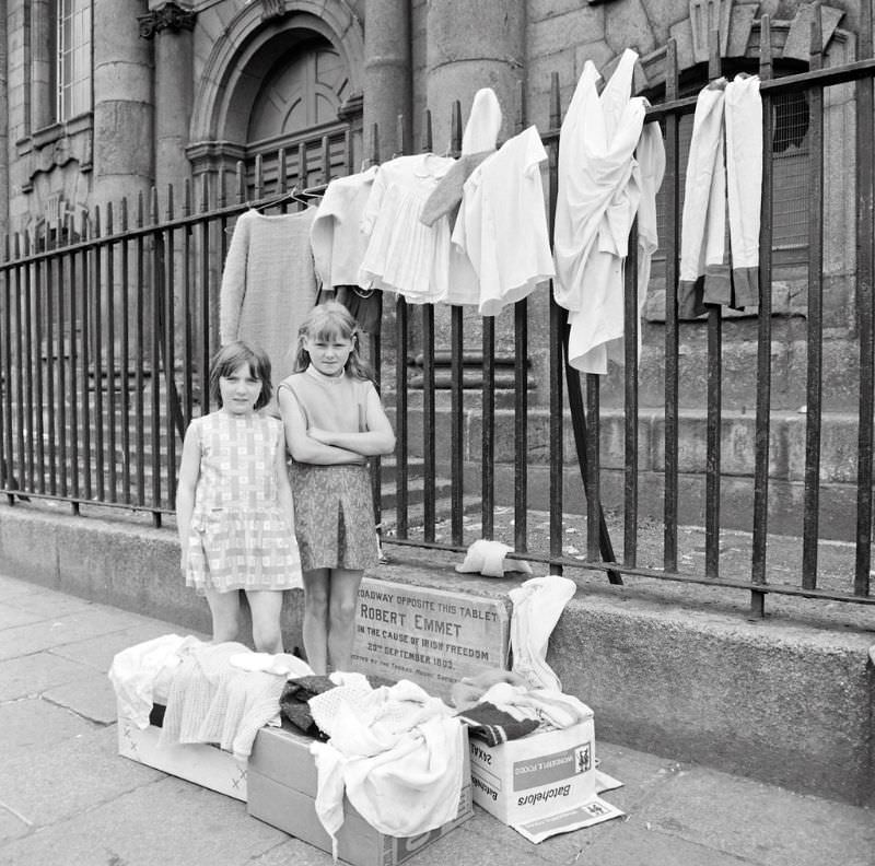 #3 These two young entrepreneurs had set out their “stall” in front of St. Catherine’s Church on Thomas Street in Dublin,1969