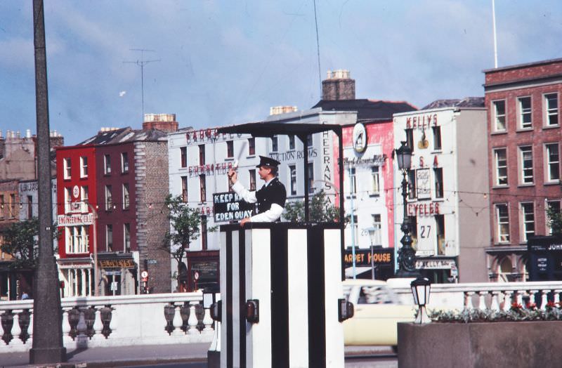 #9 Garda directing traffic, O’Connell Bridge, Dublin, 1963