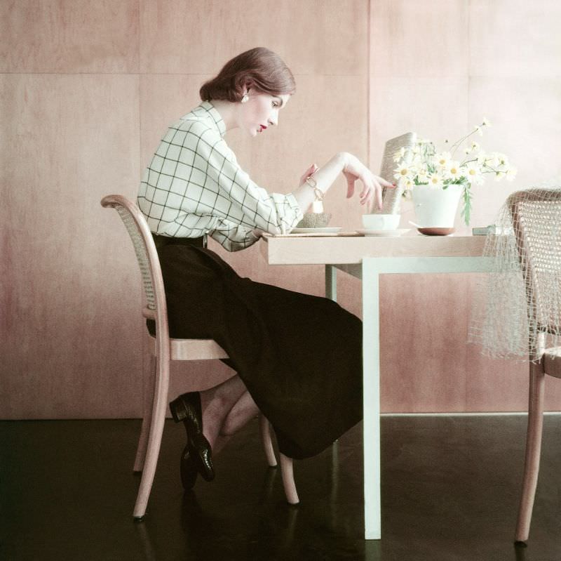 #1 Model wearing a brown and white window pane plaid flannel shirt and a brown wool twill skirt, 1951
