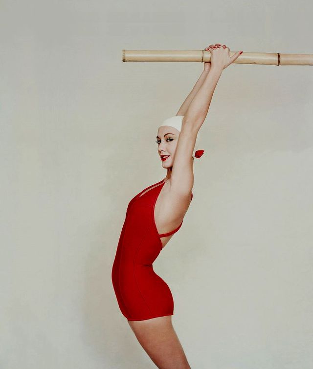 #15 Model wearing a red one-piece swimsuit, 1958
