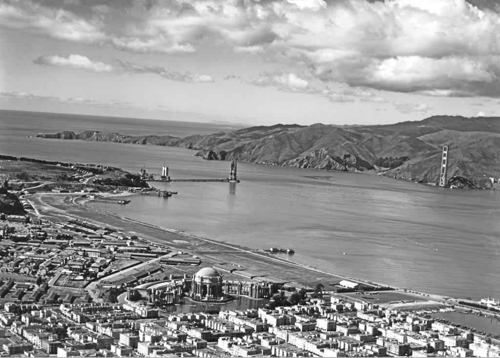 #17 Marina and the Presidio of the Golden Gate Bridge under construction with the Palace of Fine Arts in the lower center, 1935.