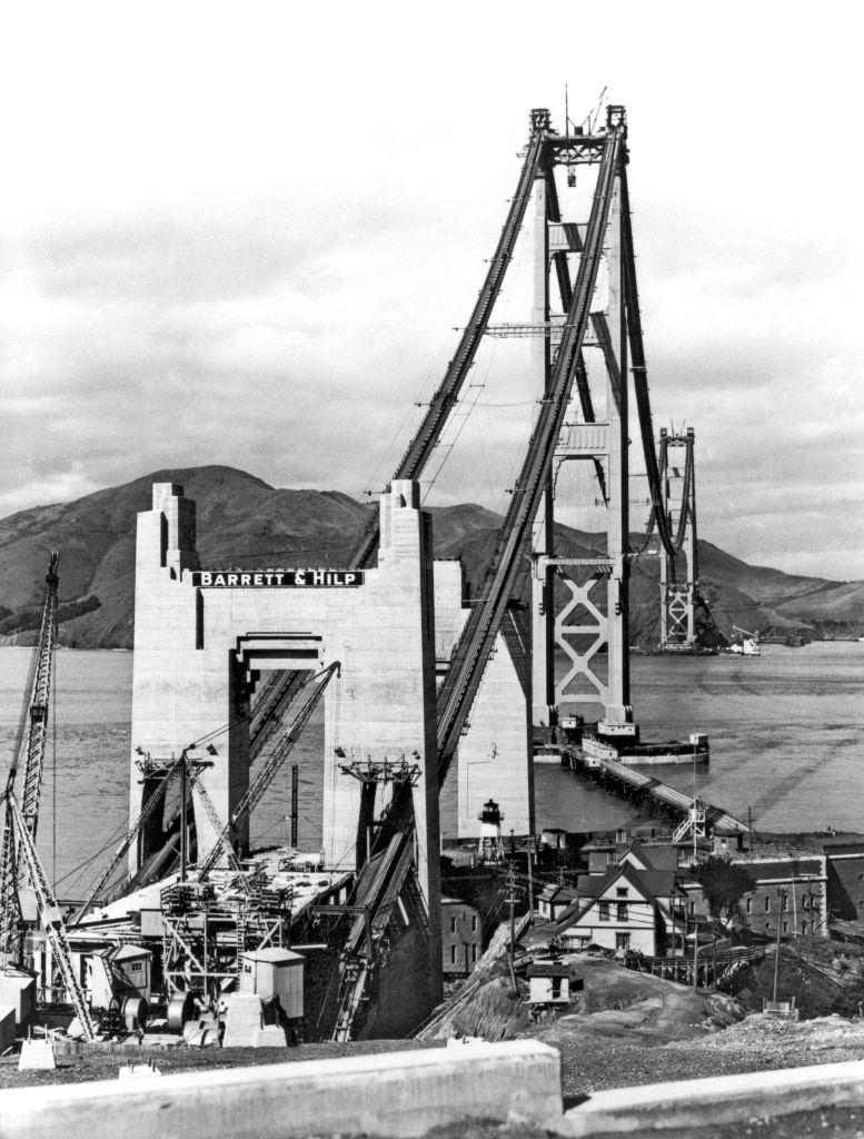 #5 The construction of the Golden Gate Bridge, with the catwalks attached to the cables in preparation of the building of the roadbed, 1935.