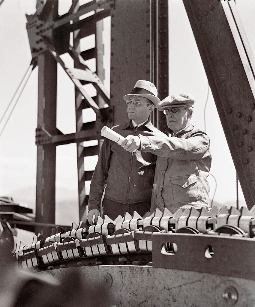 #32 Engineers surveying Golden Gate Bridge construction, 1936.