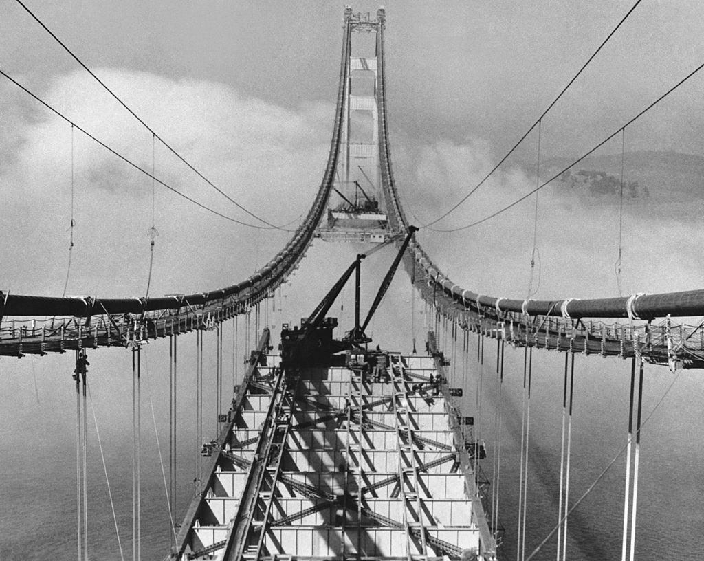 #34 Setting roadbed sections in the fog during the construction of the Golden Gate Bridge, San Francisco, October 29, 1936.