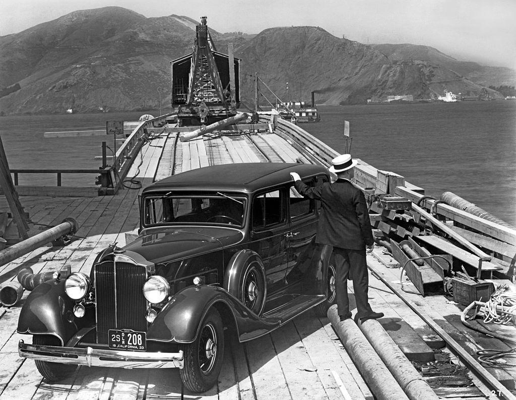 #11 A man with a 1933 Packard on the trestle to the South Tower during the beginning of the construction of the Golden Gate Bridge