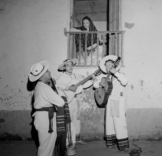 #11 Local boys sing and plays the guitar to serenade a woman in Patzcuaro.