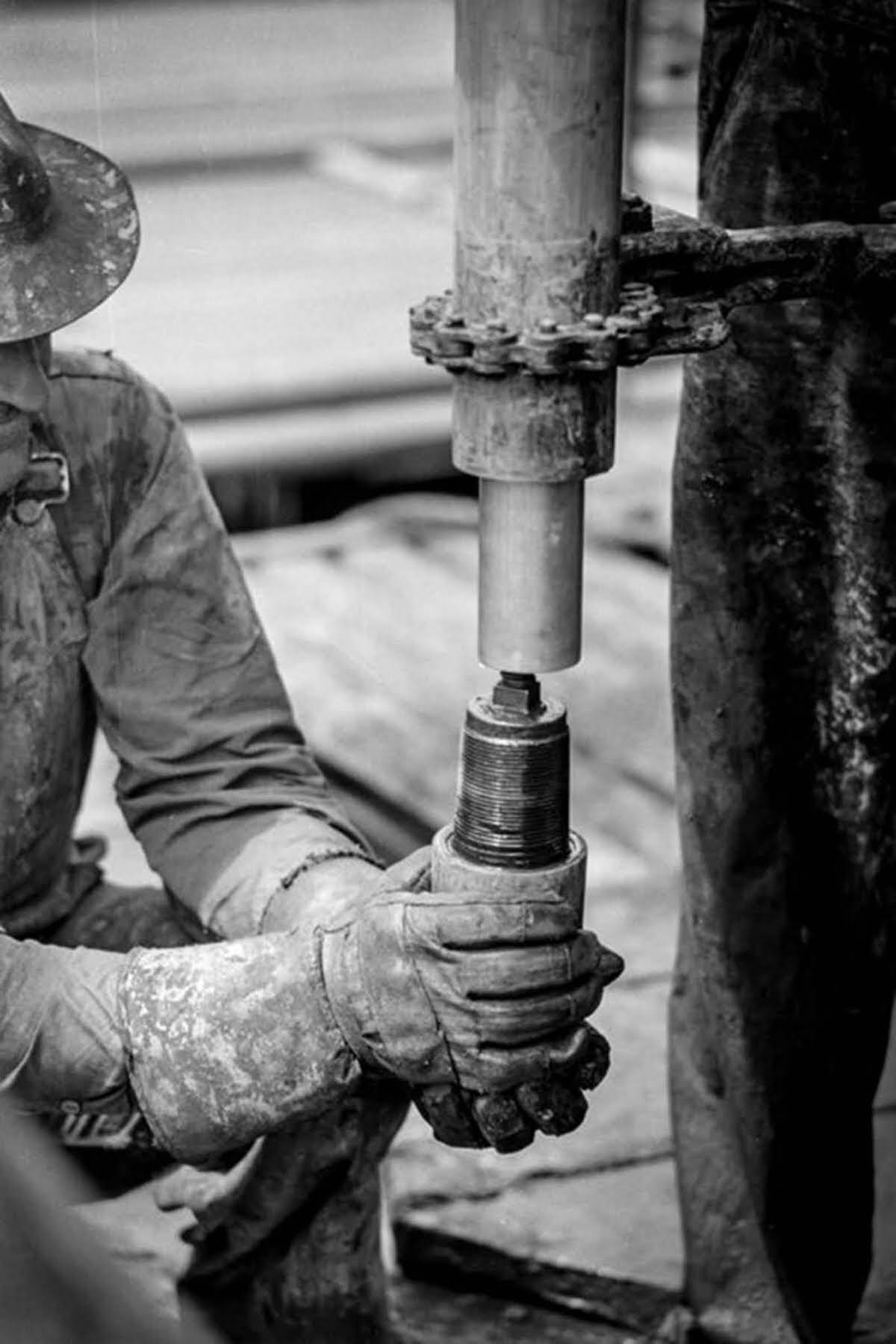 #6 A worker screws on a nipple.