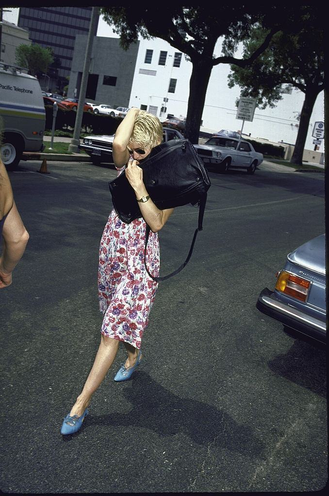 #3 Madonna hiding from a Paparazzi, 1986.
