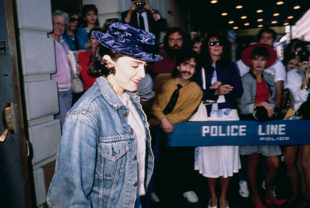 #73 Madonna wearing a purple velvet hat as she leaves a theatre on Broadway, New York City, circa 1988.