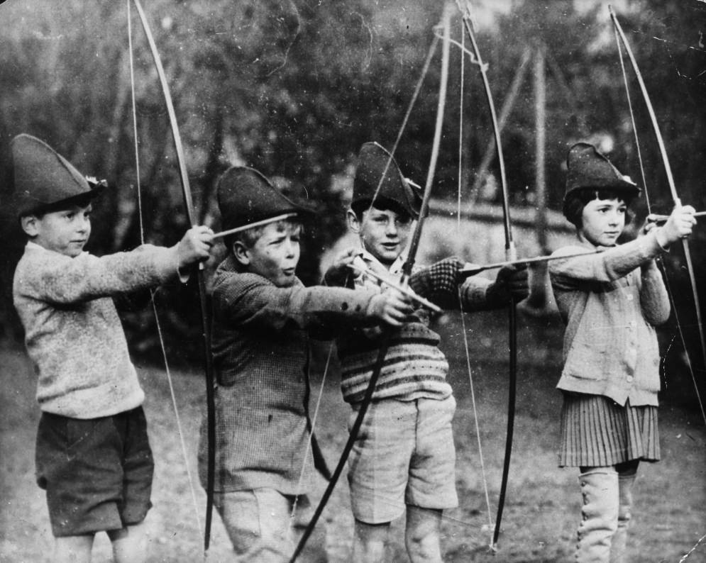 #18 Philip of Greece (second from the left) trying his hand at archery with his schoolmates at the MacJannet American school in France, 1929.