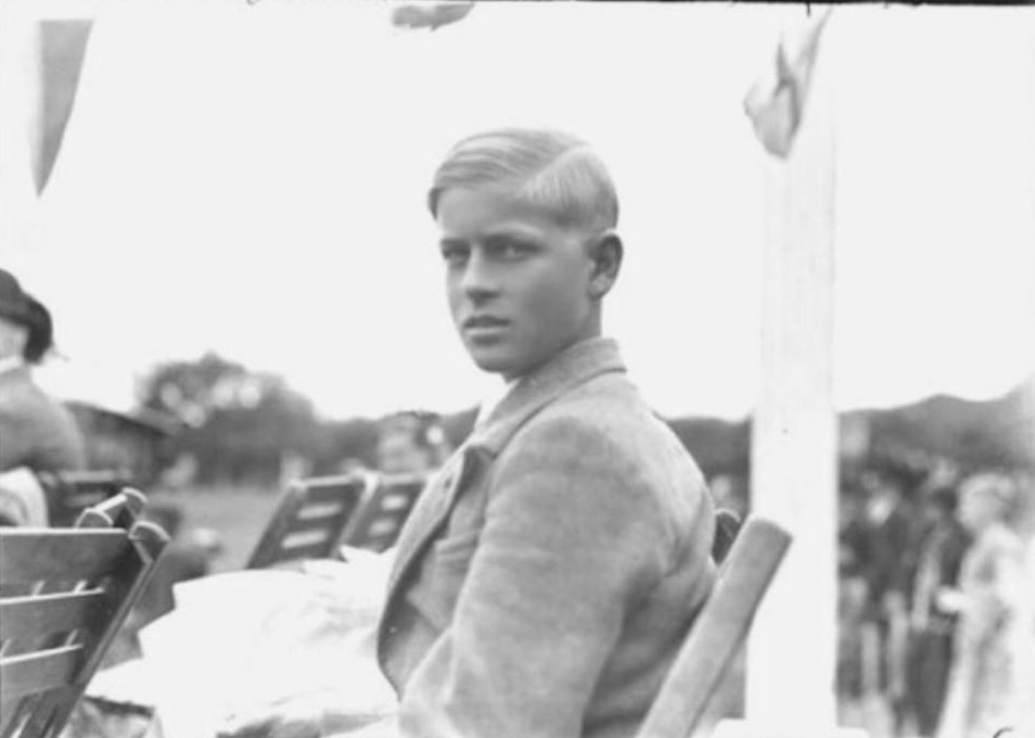 #24 Philip sitting on a chair, He was 14-years-old.