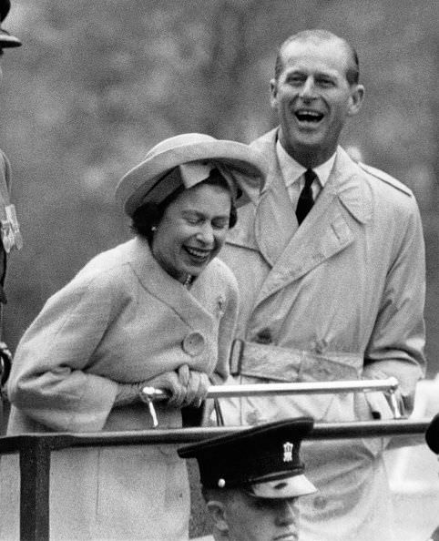 #37 Prince Philip and the Queen having a laugh, 1963.