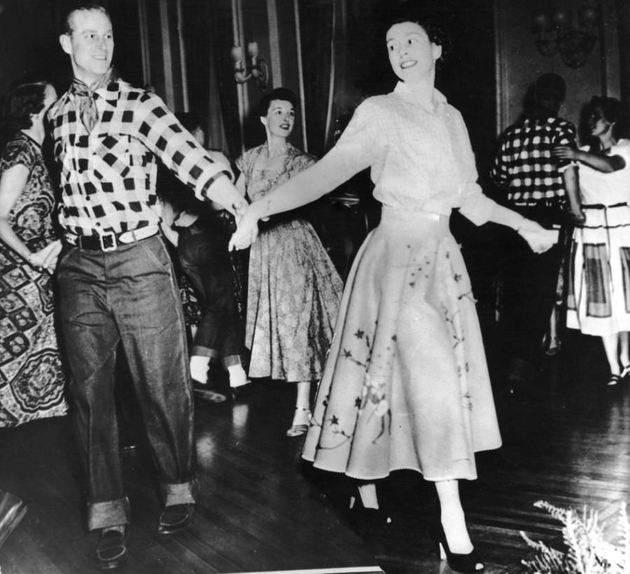 #40 Prince Philip with Princess Elizabeth at a square dance held in their honor in Ottawa.