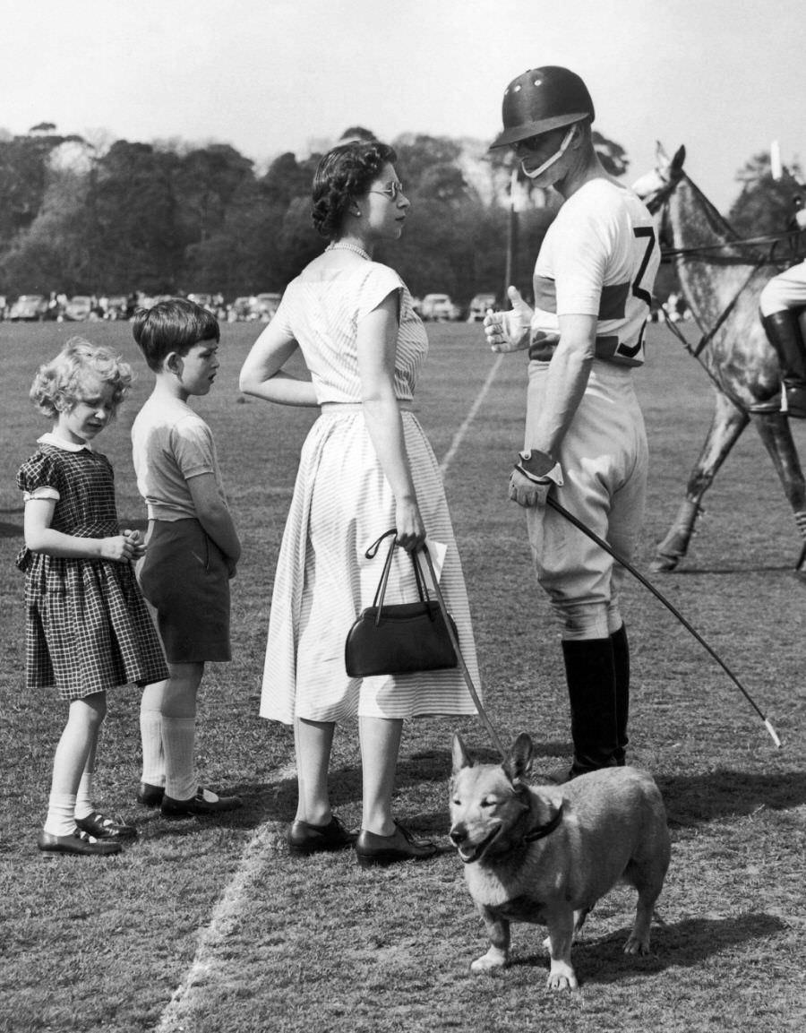 #46 Prince Philip with Queen during a polo game in Windsor Park, 1957.