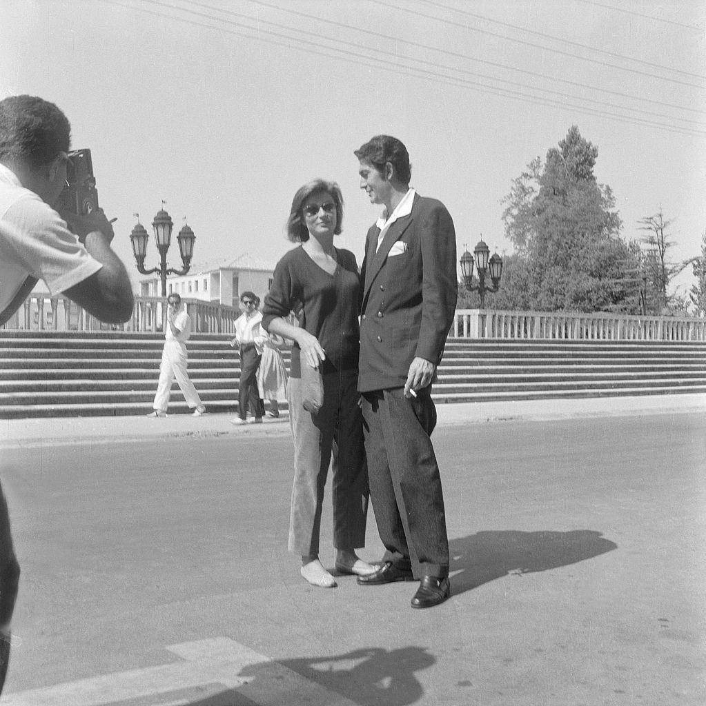 #47 Anouk Aimée posing with a man during the XVI Venice International Film Festival, 1950