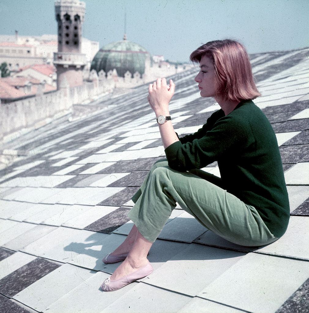 #12 Anouk Aimee sitting on the Hotel Excelsior roof, 1955.