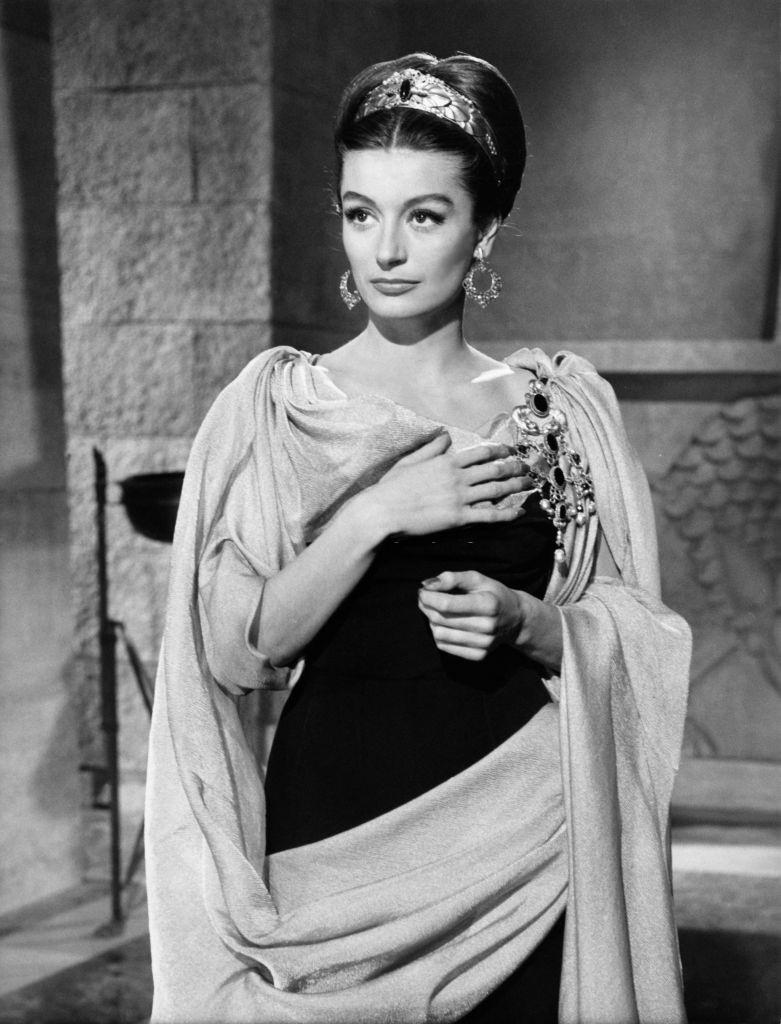 #15 Anouk Aimee wearing a period costume, 1960.