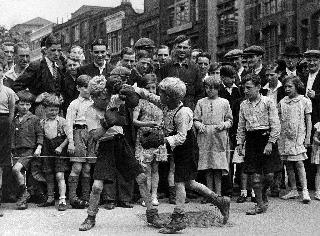 #4 Boxing match in the street at Clerkenwell Green, a company of little boys arranged a boxing match.