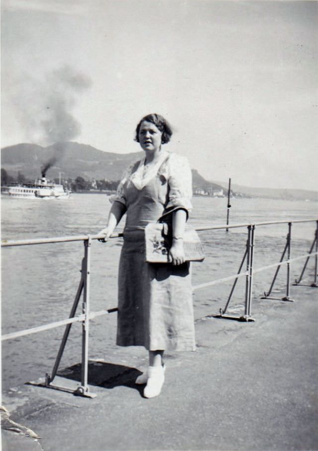 #23 A fashionable lady posing on Bonn’s Rhine Promenade on a sunny summer’s day, 1935