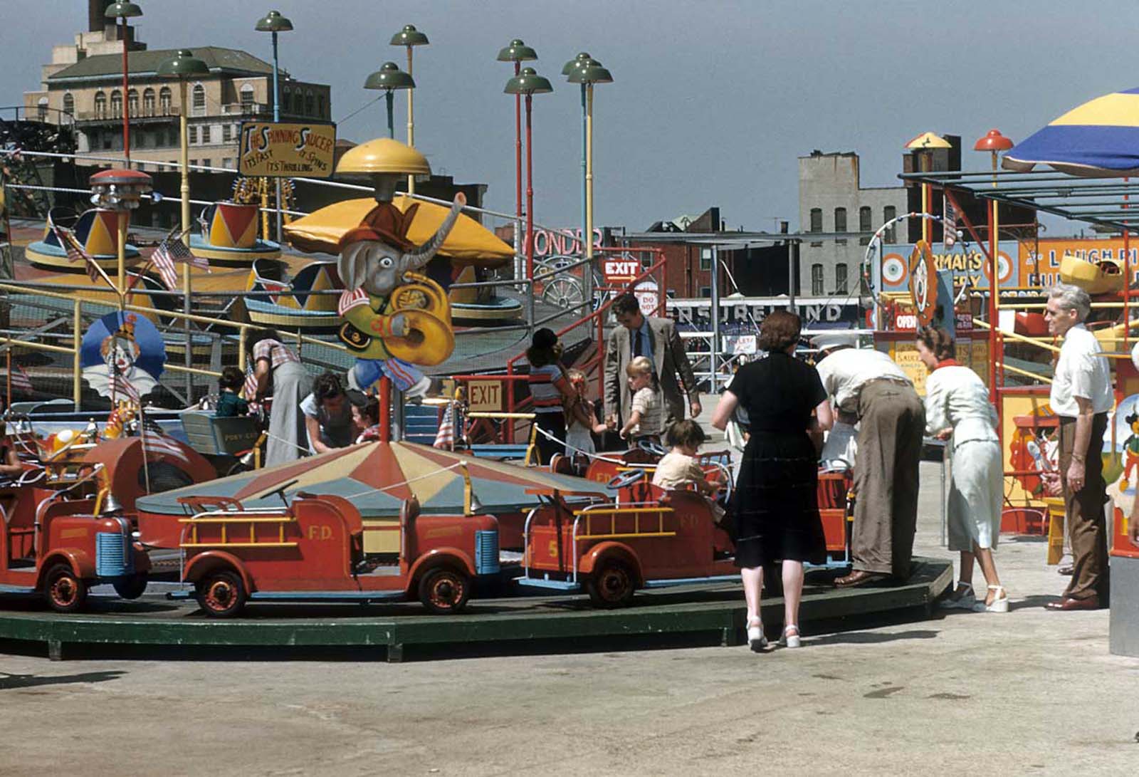 #11 The Spinning saucer and other rides at Coney Island.
