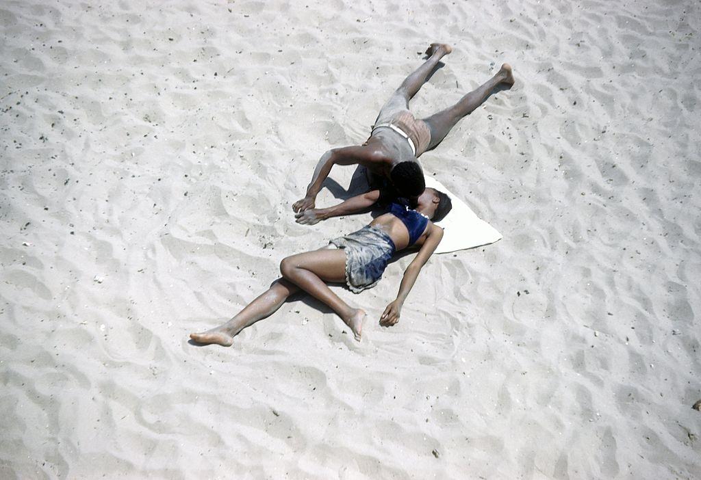 #15 An African American couple canoodle on Coney Island beach, 1948.