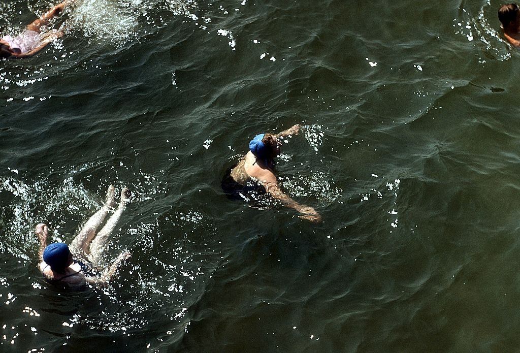 #19 Swimmers frolic in the ocean off Coney Island, 1948.