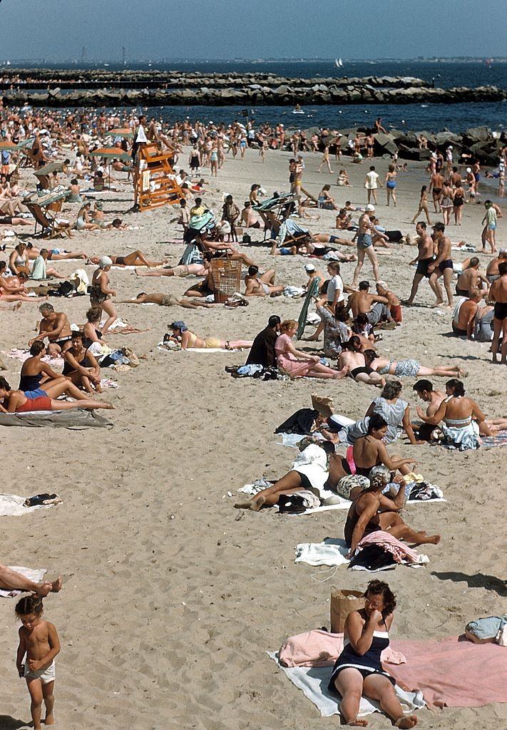 #36 Sunbathers on Coney Island beach circa 1948 in Brooklyn.