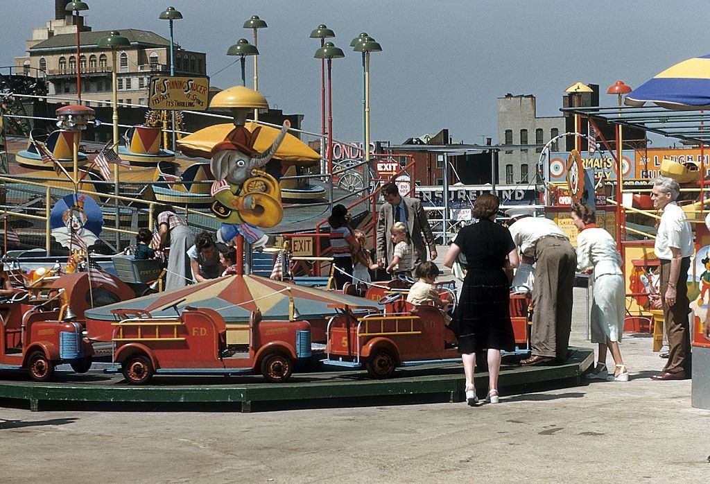 #44 A view of Thew Spinning saucer and other rides at Coney Island, 1948.