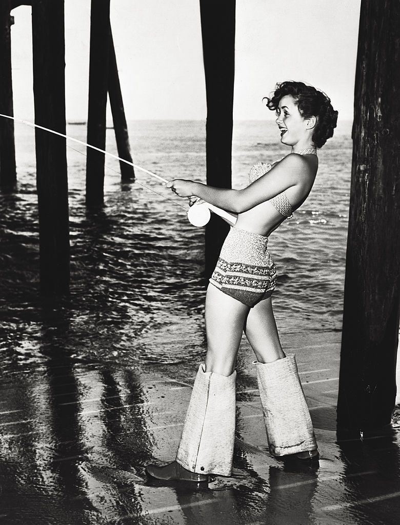 #3 Debbie Reynolds fishing by the sea, during a break in the shooting of ‘Three little words’, 1950.