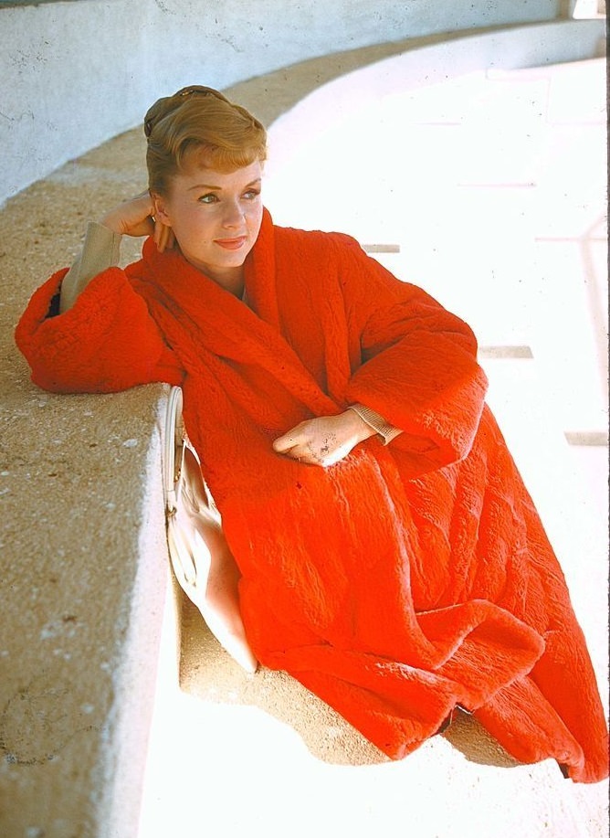 #74 Debbie Reynolds in red coat, 1959.